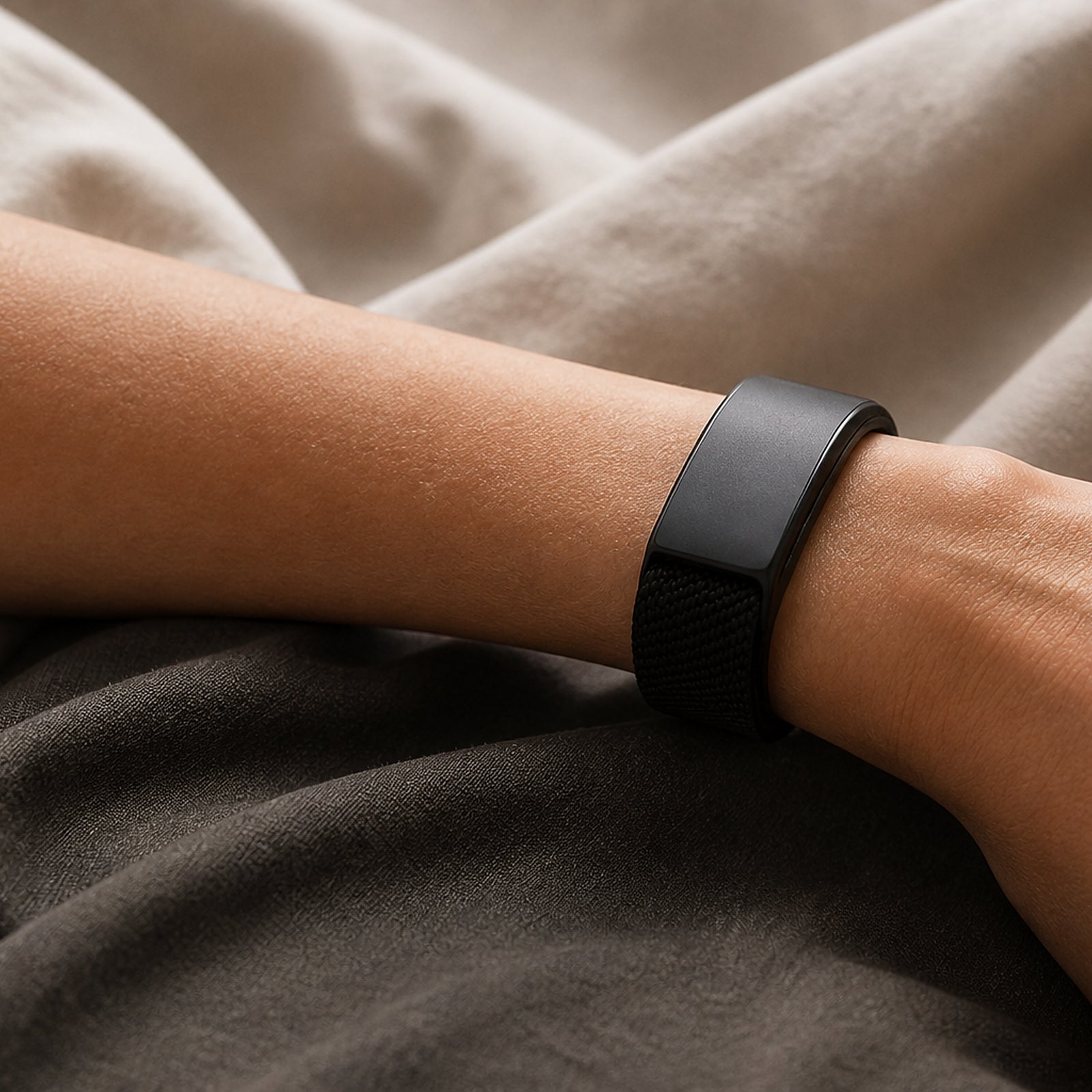Close-up of the black woven Selntz Flow bracelet on a wrist